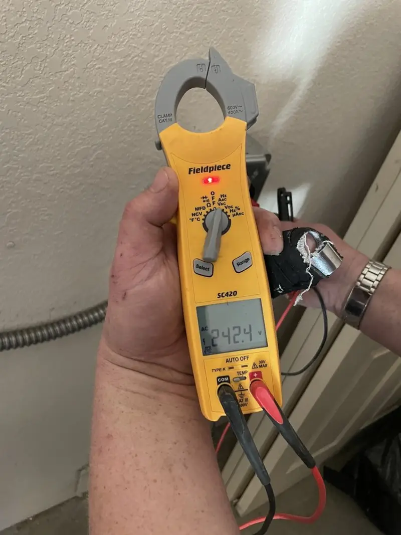 Voltage testing with clamp meter during Generator Installation in Oak Park Heights